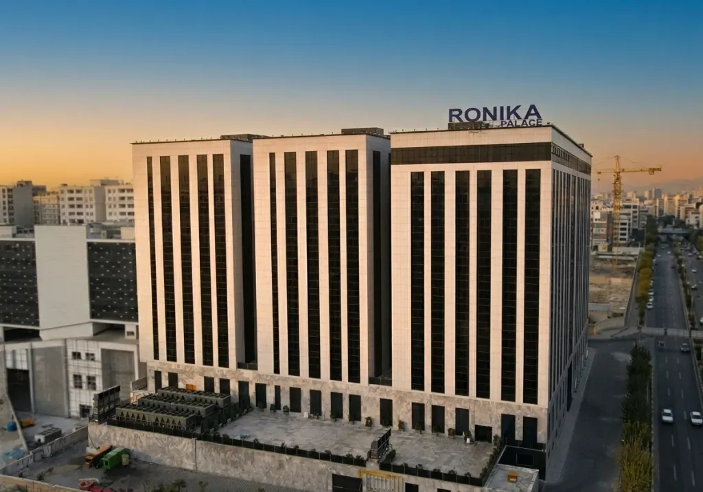 Aerial view of Ronika Palace towers with the brand signage on the rooftop