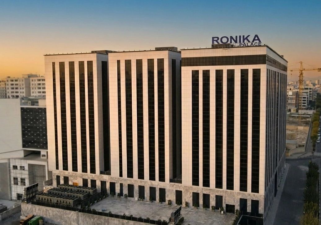 Aerial view of Ronika Palace tower with brand signage on rooftop